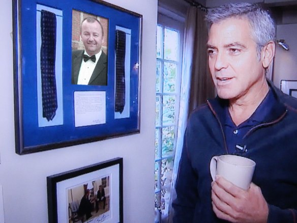 George admires his display of                                  Sharp Single Coffee Club ties.