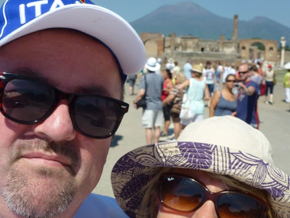 Proving that there should be an age-limit to prevent old people attempting selfies. That's Mt Vesuvius in the middle, no idea who the two people in the foreground are. 
